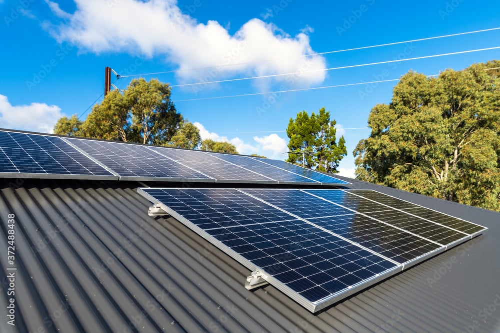 new solar panels on metal sheet roof